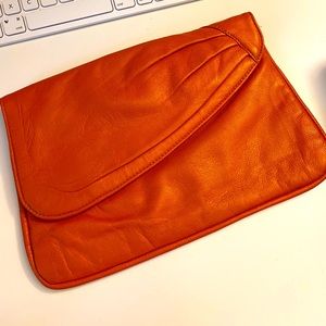 Vintage orange leather clutch